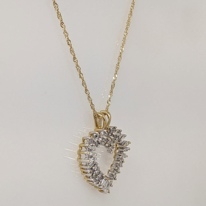 14K .76 CARAT TOTAL WEIGHT I1 H DIAMOND ROUND (27) BAGUETTE (11) ESTATE HEART PENDANT & CHAIN 4.4 GRAMS