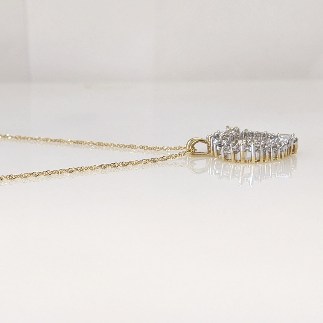 14K .76 CARAT TOTAL WEIGHT I1 H DIAMOND ROUND (27) BAGUETTE (11) ESTATE HEART PENDANT & CHAIN 4.4 GRAMS