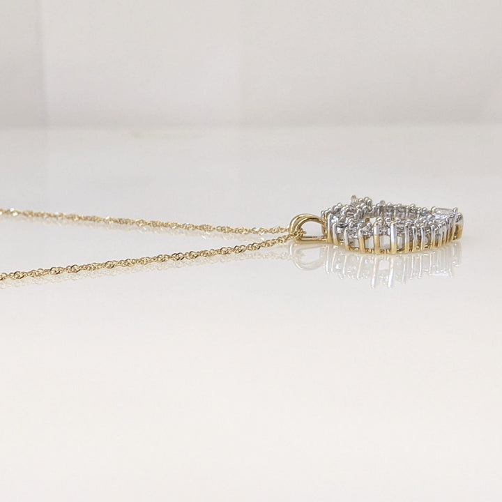 14K .76 CARAT TOTAL WEIGHT I1 H DIAMOND ROUND (27) BAGUETTE (11) ESTATE HEART PENDANT & CHAIN 4.4 GRAMS
