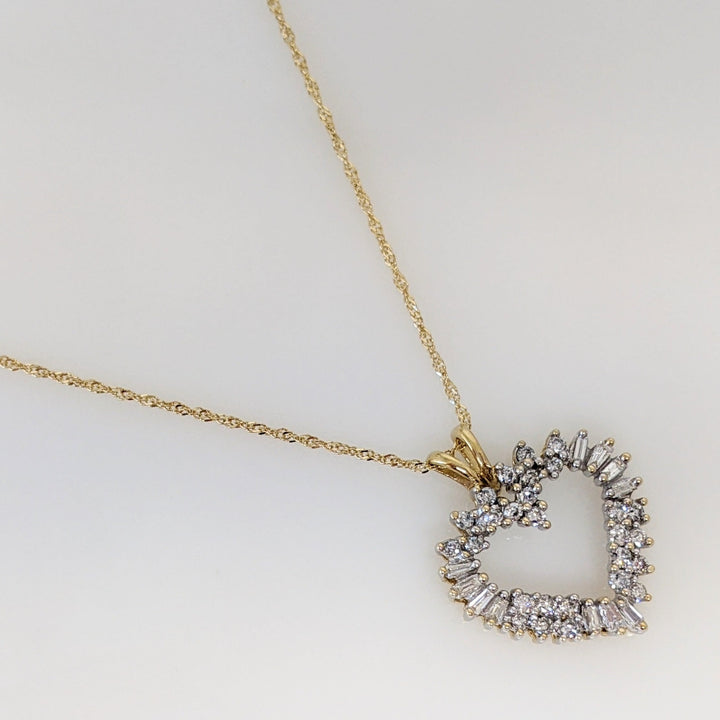 14K .76 CARAT TOTAL WEIGHT I1 H DIAMOND ROUND (27) BAGUETTE (11) ESTATE HEART PENDANT & CHAIN 4.4 GRAMS
