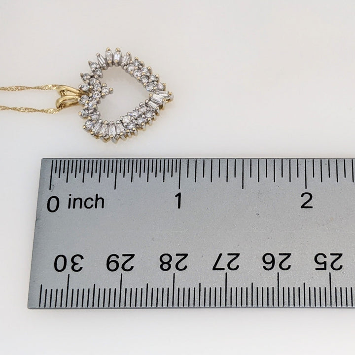 14K .76 CARAT TOTAL WEIGHT I1 H DIAMOND ROUND (27) BAGUETTE (11) ESTATE HEART PENDANT & CHAIN 4.4 GRAMS