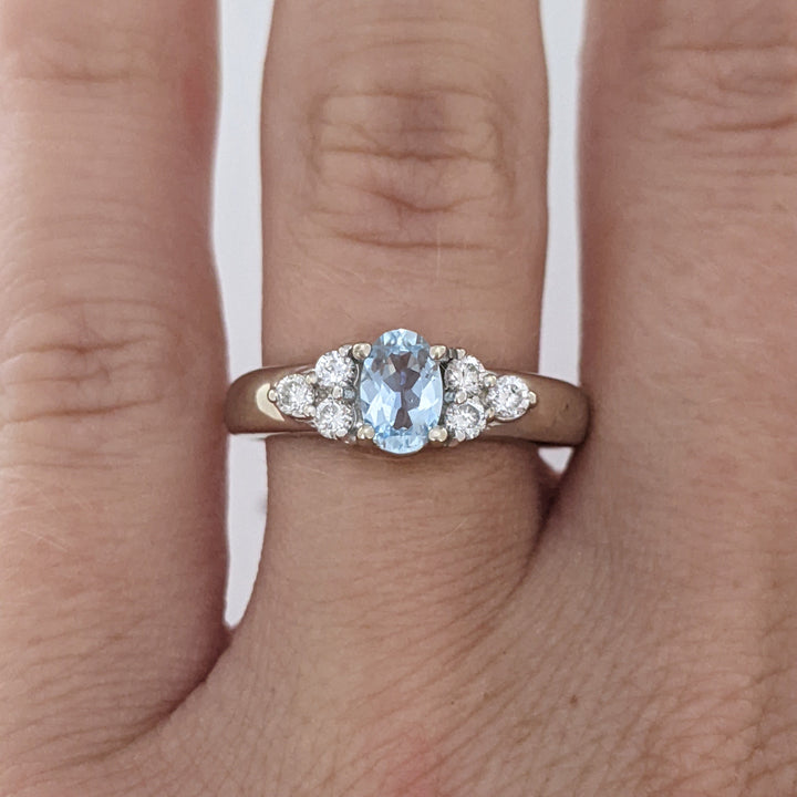 14K WHITE AQUAMARINE OVAL 4X6 WITH .18 DIAMOND TOTAL WEIGHT (6) ROUND ESTATE RING 3.1 GRAMS
