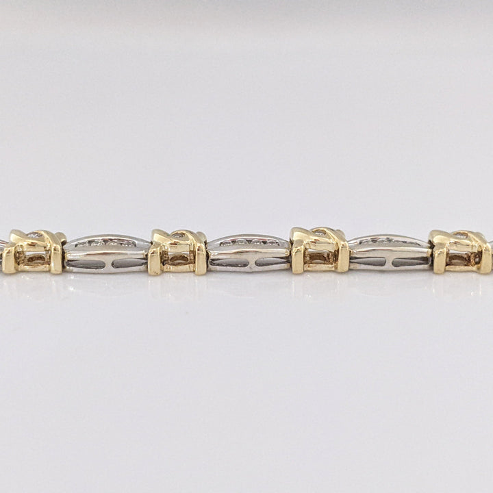 14K TWO-TONE .98 CARAT TOTAL WEIGHT I1 J-K DIAMOND ROUND (60) CHANNEL SET LINK ESTATE BRACELET 12.7 GRAMS