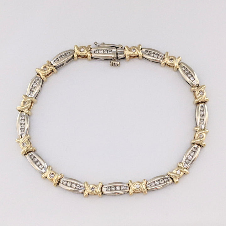 14K TWO-TONE .98 CARAT TOTAL WEIGHT I1 J-K DIAMOND ROUND (60) CHANNEL SET LINK ESTATE BRACELET 12.7 GRAMS
