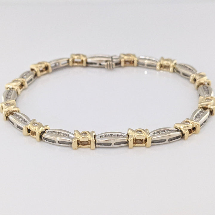 14K TWO-TONE .98 CARAT TOTAL WEIGHT I1 J-K DIAMOND ROUND (60) CHANNEL SET LINK ESTATE BRACELET 12.7 GRAMS