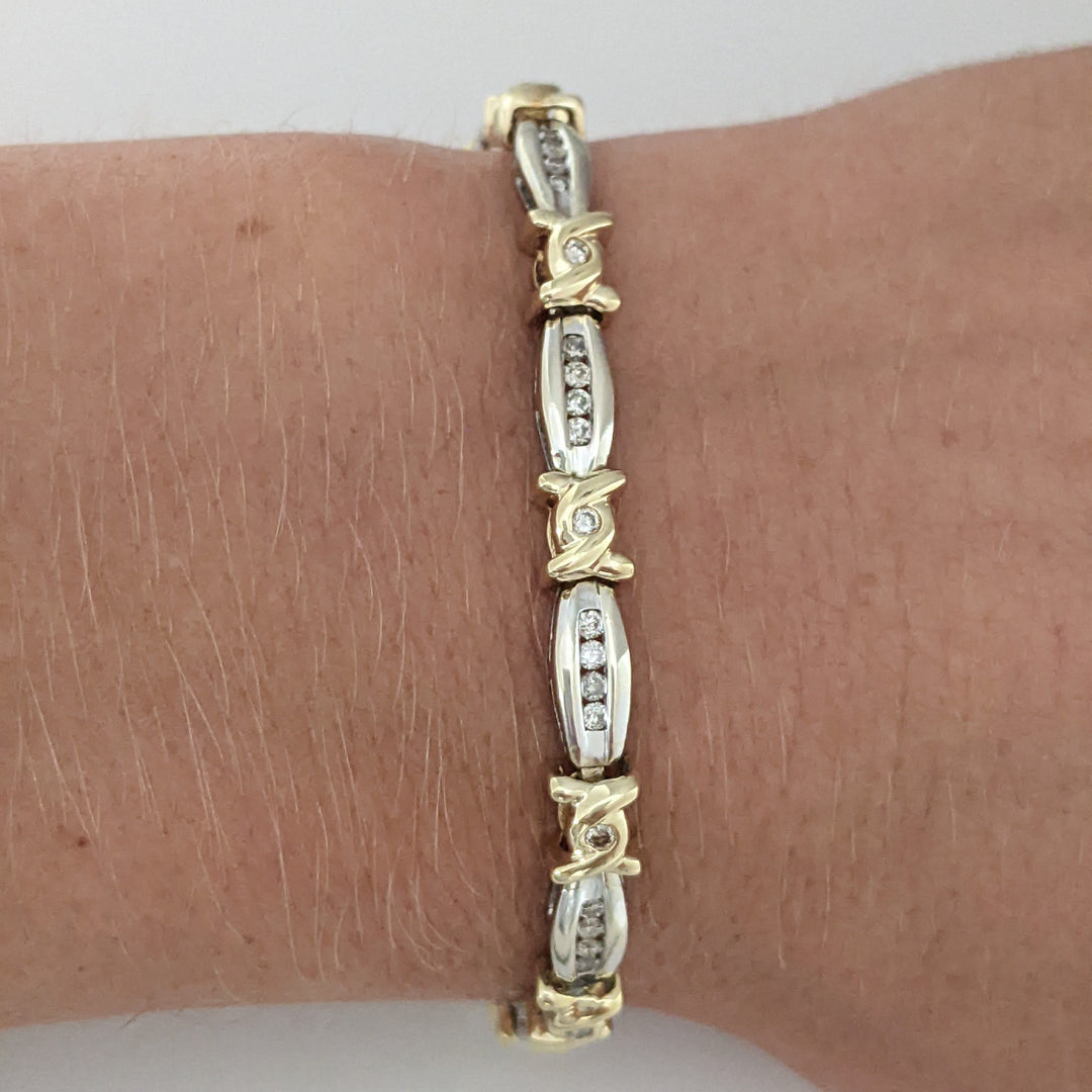 14K TWO-TONE .98 CARAT TOTAL WEIGHT I1 J-K DIAMOND ROUND (60) CHANNEL SET LINK ESTATE BRACELET 12.7 GRAMS