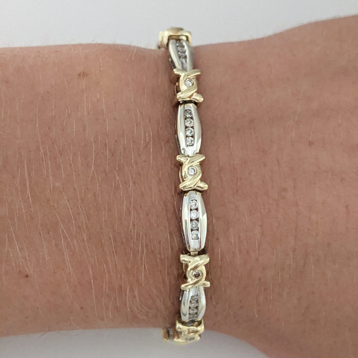 14K TWO-TONE .98 CARAT TOTAL WEIGHT I1 J-K DIAMOND ROUND (60) CHANNEL SET LINK ESTATE BRACELET 12.7 GRAMS