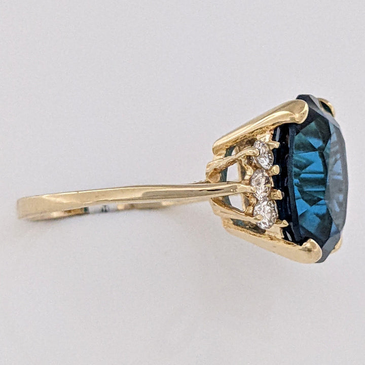 14K LONDON BLUE TOPAZ OVAL 10X12 WITH (6) MELEE ESTATE RING 3.3 GRAMS