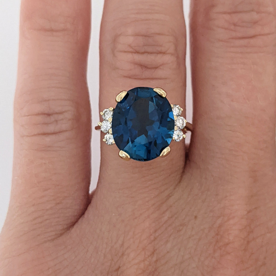 14K LONDON BLUE TOPAZ OVAL 10X12 WITH (6) MELEE ESTATE RING 3.3 GRAMS