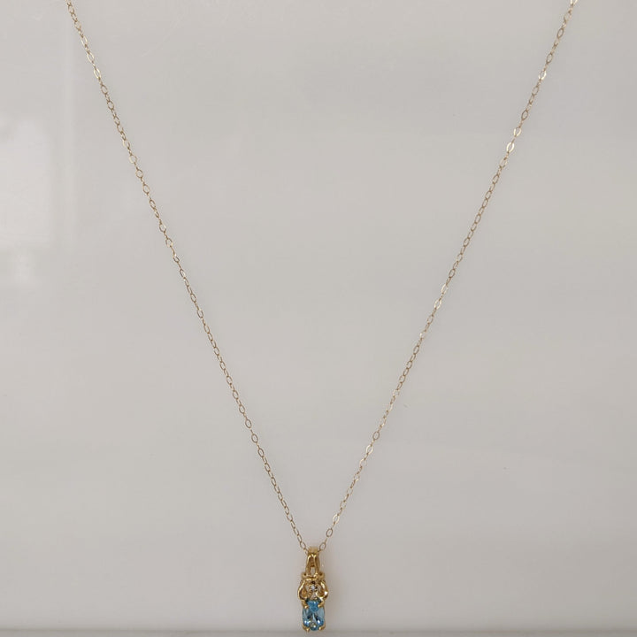 10K BLUE TOPAZ OVAL 4X6 WITH MELEE ESTATE PENDANT & CHAIN 1.1 GRAMS