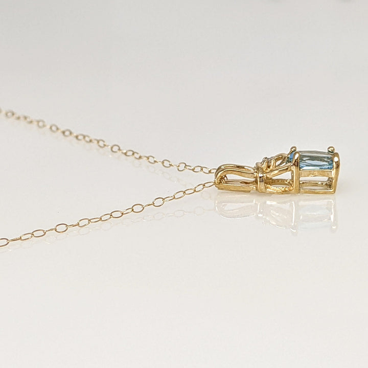 10K BLUE TOPAZ OVAL 4X6 WITH MELEE ESTATE PENDANT & CHAIN 1.1 GRAMS
