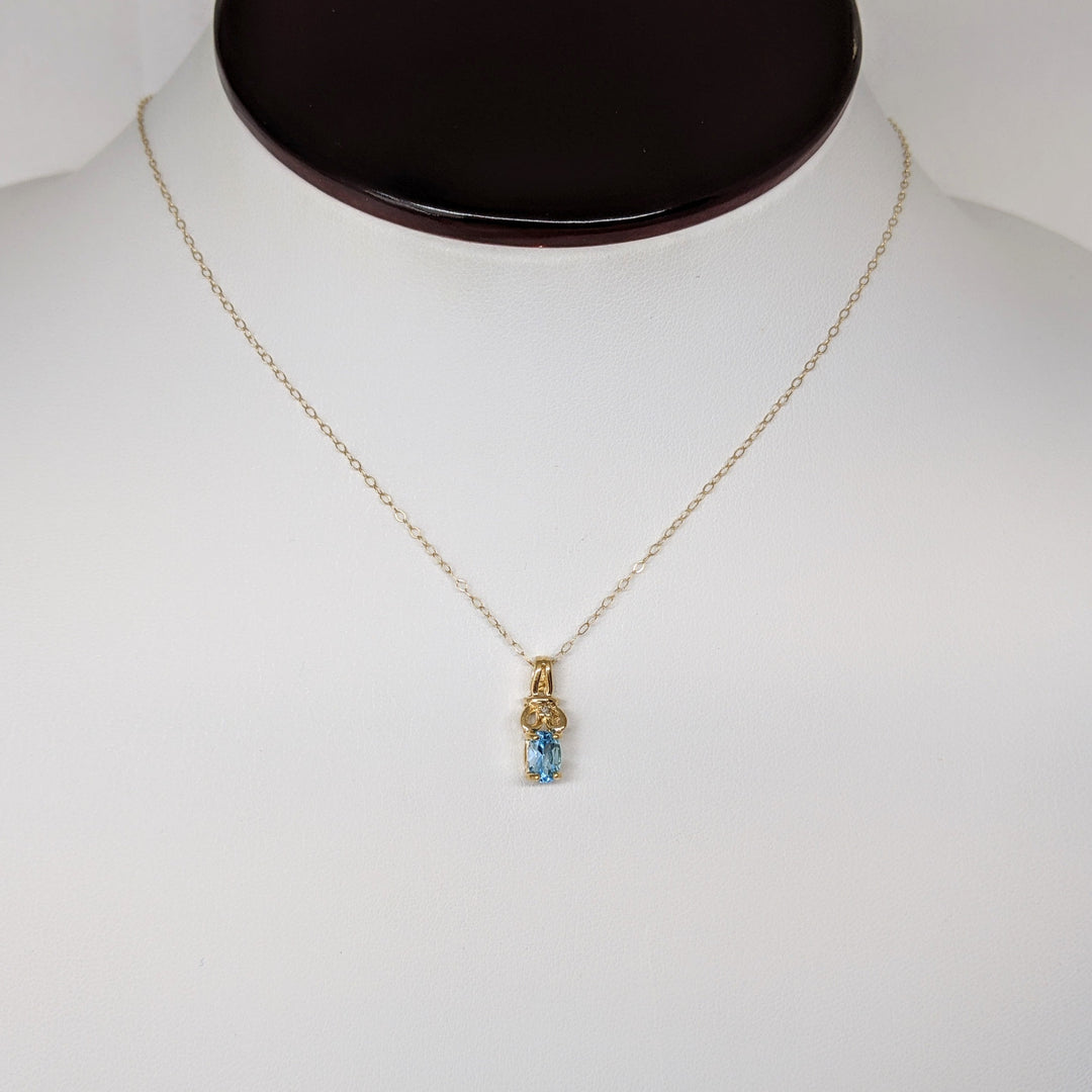 10K BLUE TOPAZ OVAL 4X6 WITH MELEE ESTATE PENDANT & CHAIN 1.1 GRAMS