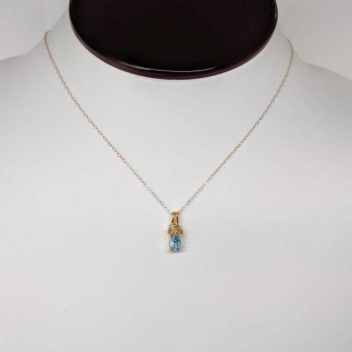 10K BLUE TOPAZ OVAL 4X6 WITH MELEE ESTATE PENDANT & CHAIN 1.1 GRAMS