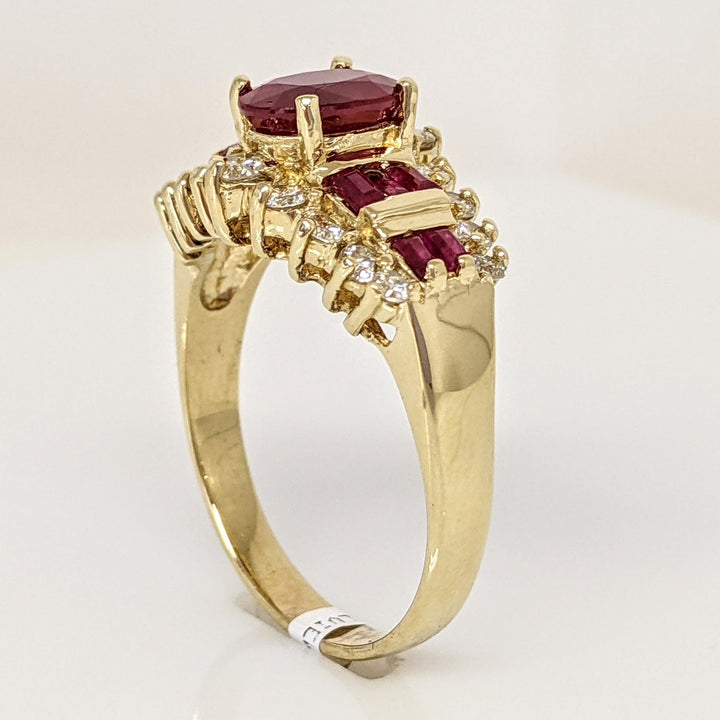 14K LAB-CREATED RUBY OVAL 6X8 WITH (10) BAGUETTE AND .52 DIAMOND TOTAL WEIGHT ESTATE RING 5.8 GRAMS