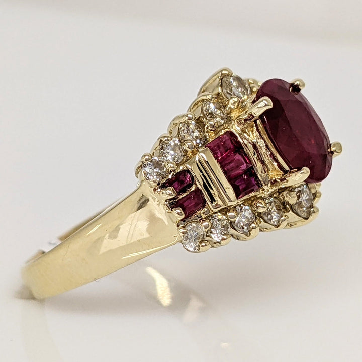 14K LAB-CREATED RUBY OVAL 6X8 WITH (10) BAGUETTE AND .52 DIAMOND TOTAL WEIGHT ESTATE RING 5.8 GRAMS