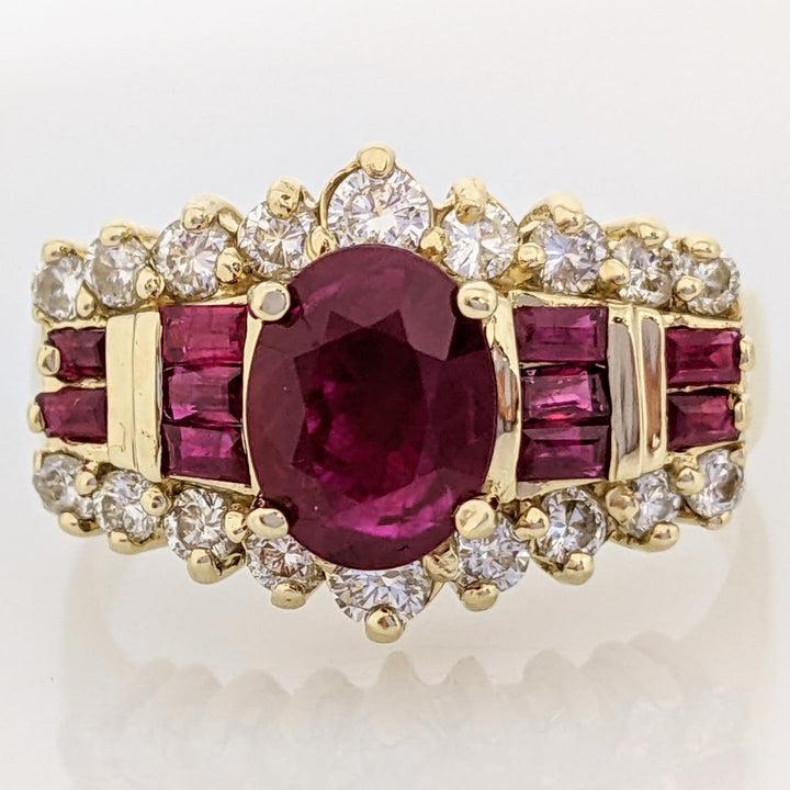 14K LAB-CREATED RUBY OVAL 6X8 WITH (10) BAGUETTE AND .52 DIAMOND TOTAL WEIGHT ESTATE RING 5.8 GRAMS
