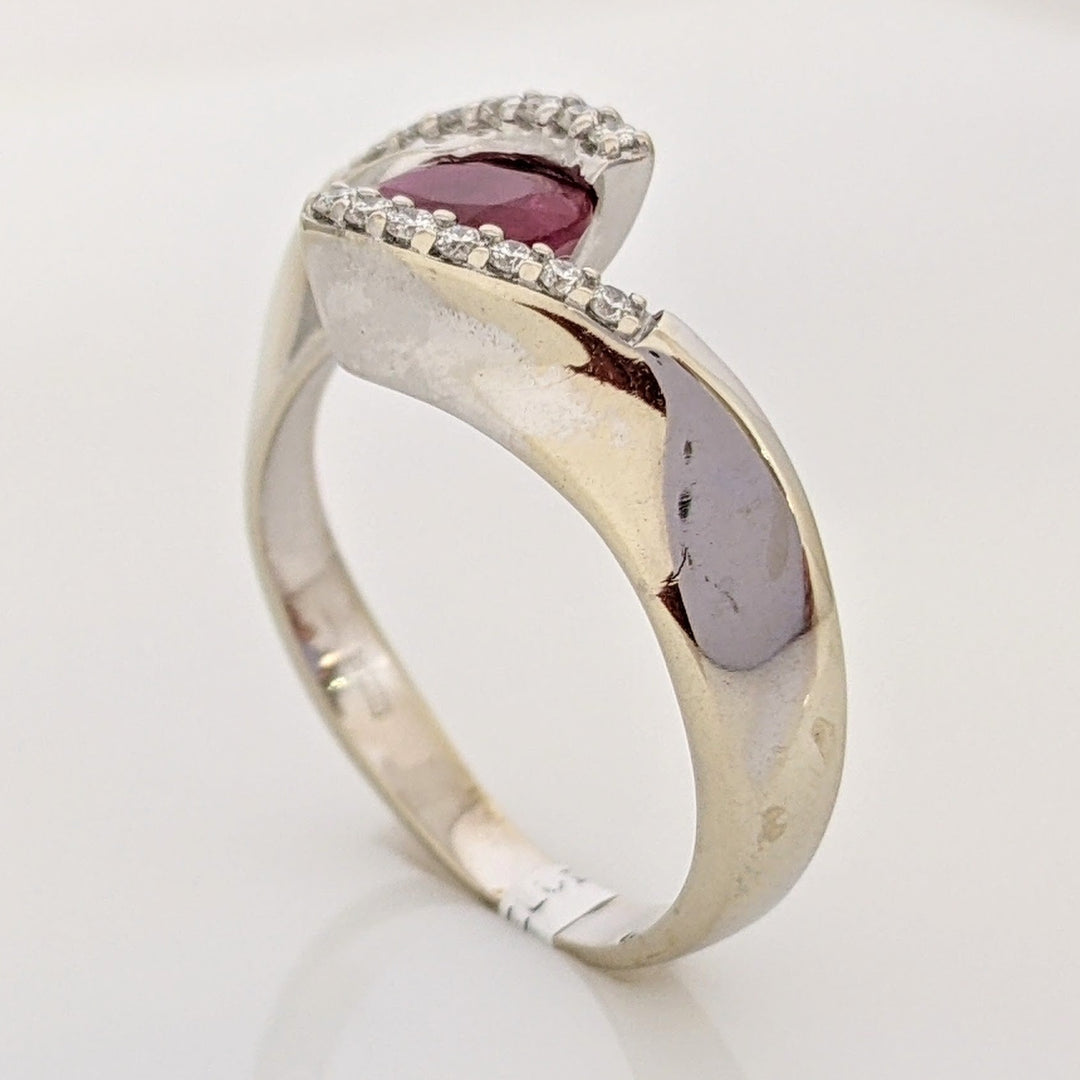14K WHITE CLARITY ENHANCED RUBY OVAL 4X7 WITH .14 DIAMOND TOTAL WEIGHT ESTATE RING 4.7 GRAMS