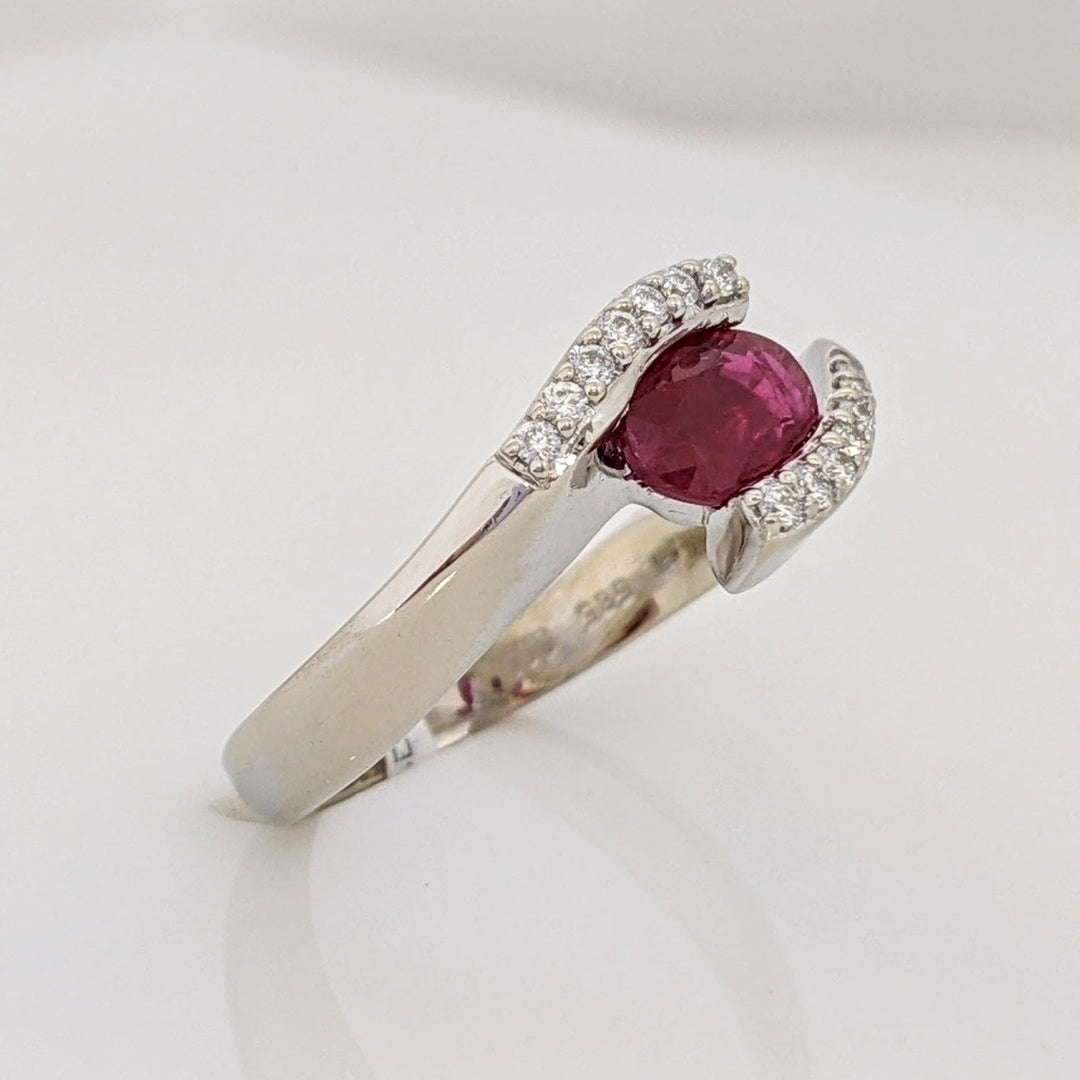 14K WHITE CLARITY ENHANCED RUBY OVAL 4X7 WITH .14 DIAMOND TOTAL WEIGHT ESTATE RING 4.7 GRAMS