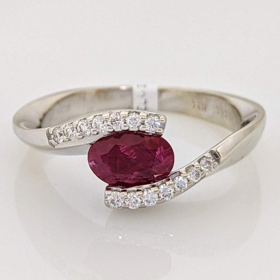 14K WHITE CLARITY ENHANCED RUBY OVAL 4X7 WITH .14 DIAMOND TOTAL WEIGHT ESTATE RING 4.7 GRAMS
