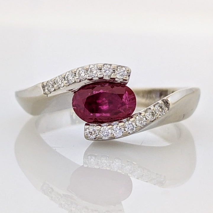 14K WHITE CLARITY ENHANCED RUBY OVAL 4X7 WITH .14 DIAMOND TOTAL WEIGHT ESTATE RING 4.7 GRAMS