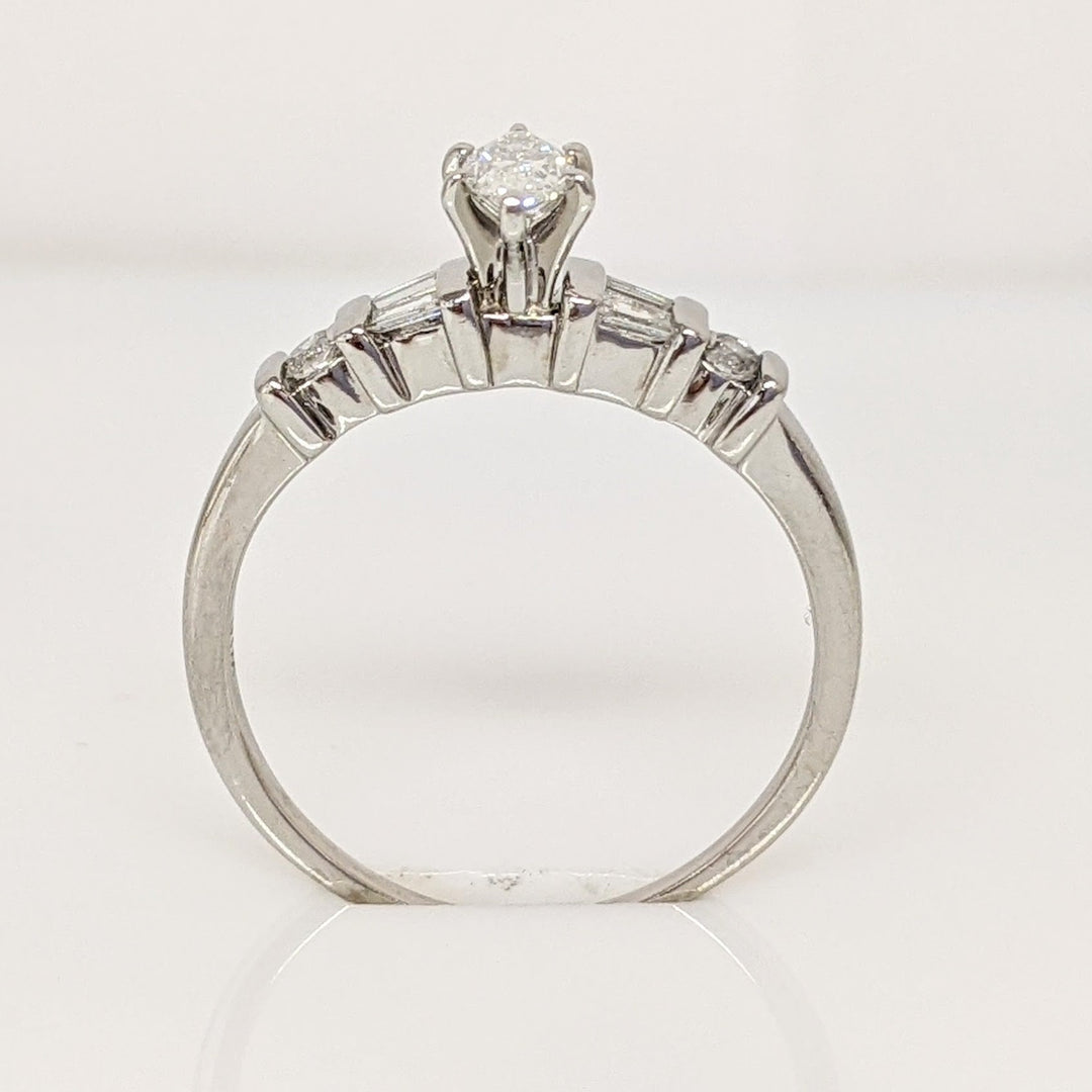 PLATINUM .41 CARAT TOTAL WEIGHT I1 F DIAMOND (1) MARQUISE CUT WITH (4) BAGUETTE CUT (2) ROUND ESTATE RING 4.0 GRAMS