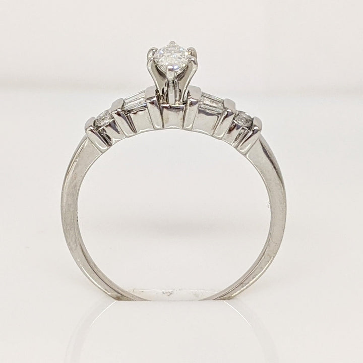 PLATINUM .41 CARAT TOTAL WEIGHT I1 F DIAMOND (1) MARQUISE CUT WITH (4) BAGUETTE CUT (2) ROUND ESTATE RING 4.0 GRAMS