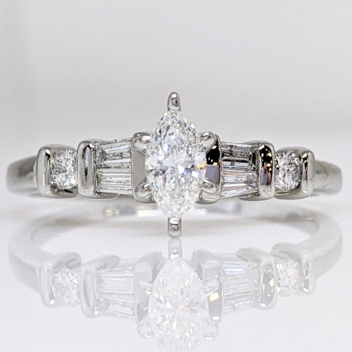 PLATINUM .41 CARAT TOTAL WEIGHT I1 F DIAMOND (1) MARQUISE CUT WITH (4) BAGUETTE CUT (2) ROUND ESTATE RING 4.0 GRAMS