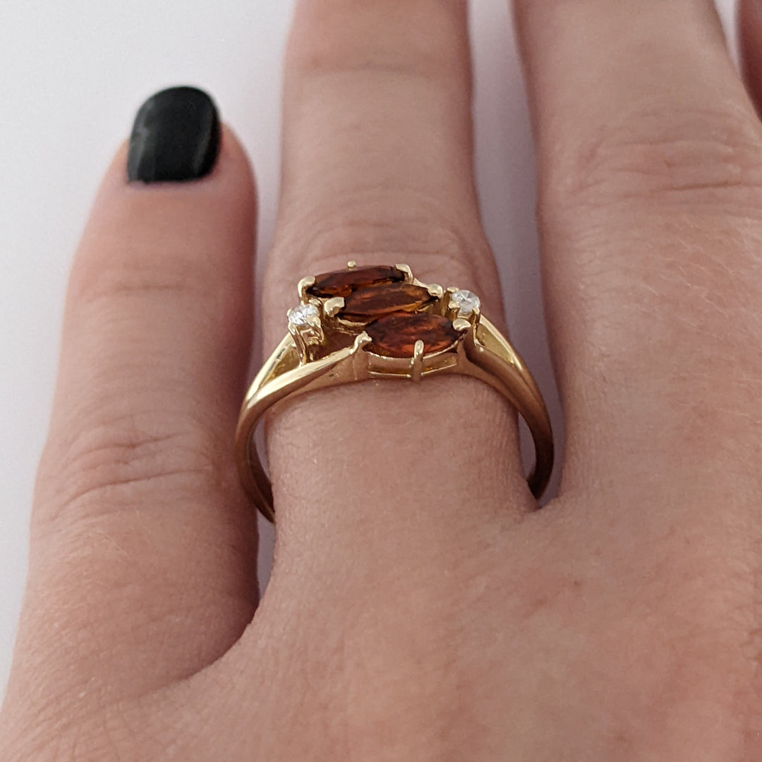 14K ORANGE GARNET MARQUISE (3) 3X5 WITH .04 DIAMOND TOTAL WEIGHT ESTATE RING 2.5 GRAMS