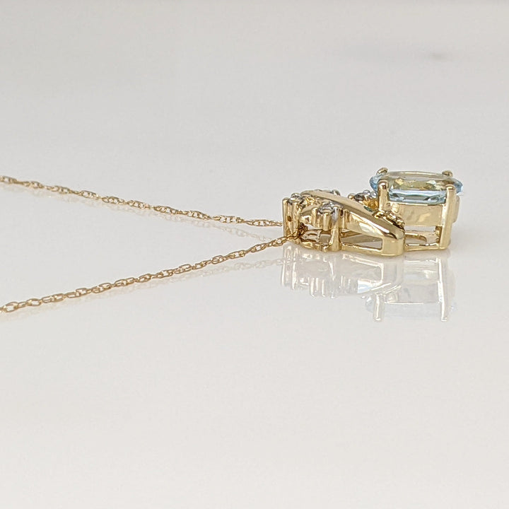 14K AQUAMARINE OVAL 6X8 WITH (4) MELEE ESTATE PENDANT & CHAIN 2.0 GRAMS