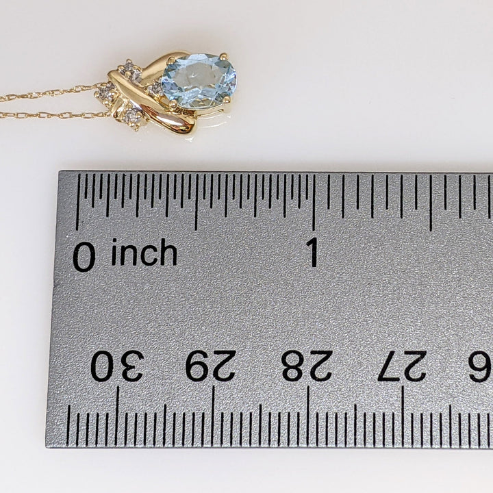 14K AQUAMARINE OVAL 6X8 WITH (4) MELEE ESTATE PENDANT & CHAIN 2.0 GRAMS