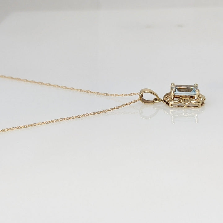 10K AQUAMARINE EMERALD CUT 5X7 WITH GOLD TRIM ESTATE PENDANT & CHAIN 1.5 GRAMS