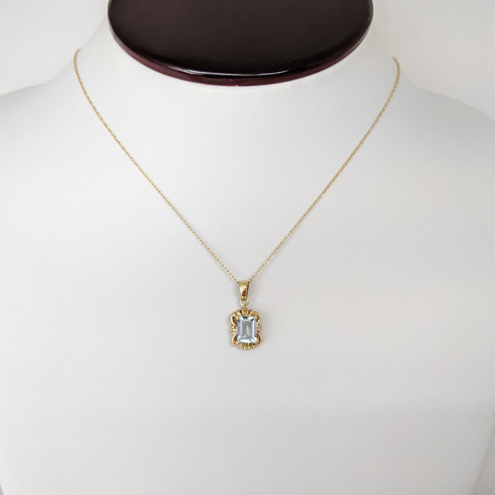 10K AQUAMARINE EMERALD CUT 5X7 WITH GOLD TRIM ESTATE PENDANT & CHAIN 1.5 GRAMS