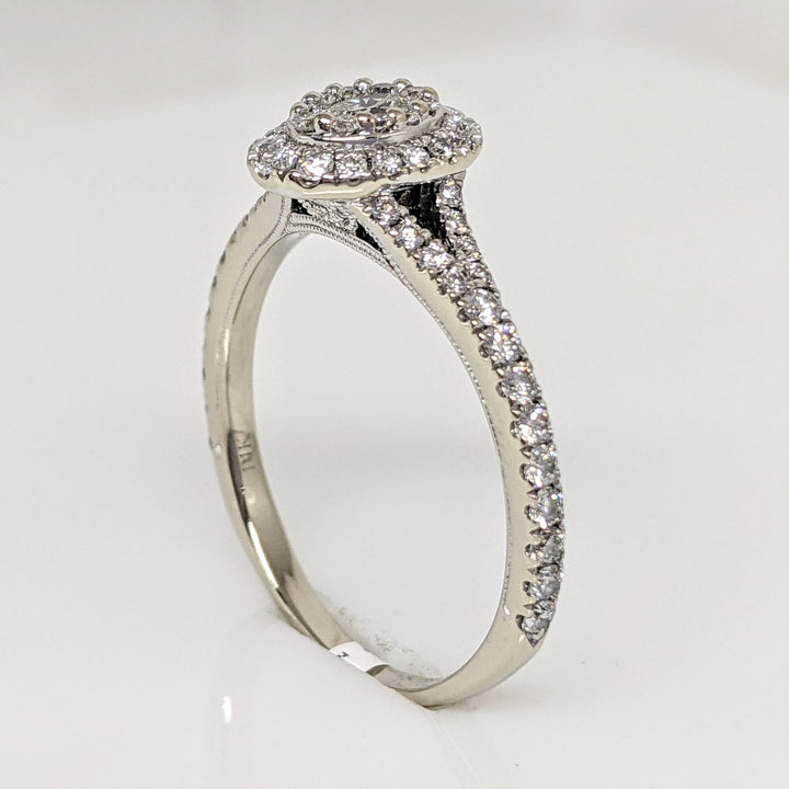 14K WHITE 1.00 CARAT TOTAL WEIGHT SI1 H DIAMOND OVAL (1) ROUND (66) NEIL LANE ESTATE RING 3.4 GRAMS