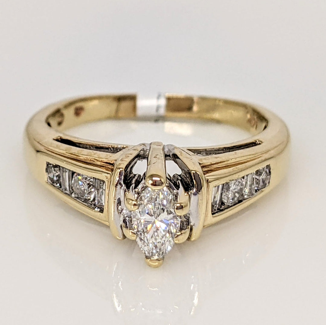 14K .57 CARAT TOTAL WEIGHT SI2 F DIAMOND MARQUISE CUT WITH (4) ROUND AND (4) BAGUETTE CUT ESTATE RING 3.9 GRAMS