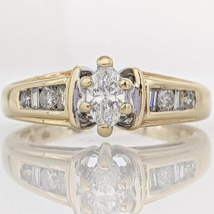 14K .57 CARAT TOTAL WEIGHT SI2 F DIAMOND MARQUISE CUT WITH (4) ROUND AND (4) BAGUETTE CUT ESTATE RING 3.9 GRAMS