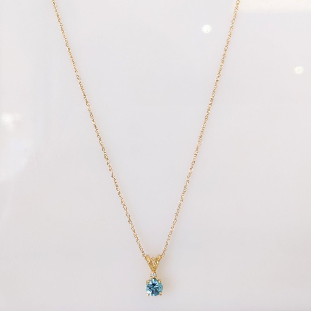 14K BLUE TOPAZ ROUND 5MM WITH MELEE ESTATE PENDANT & CHAIN 1.7 GRAMS