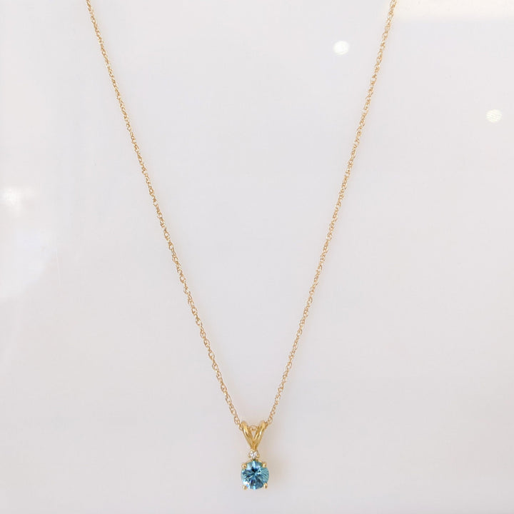 14K BLUE TOPAZ ROUND 5MM WITH MELEE ESTATE PENDANT & CHAIN 1.7 GRAMS