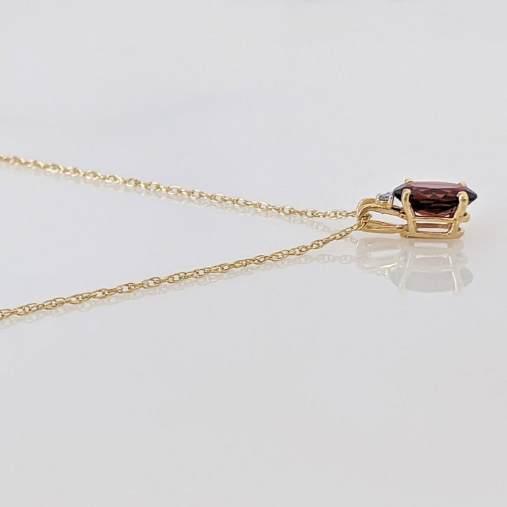 14K GARNET OVAL 6X8 WITH MELEE ESTATE PENDANT & CHAIN 1.3 GRAMS