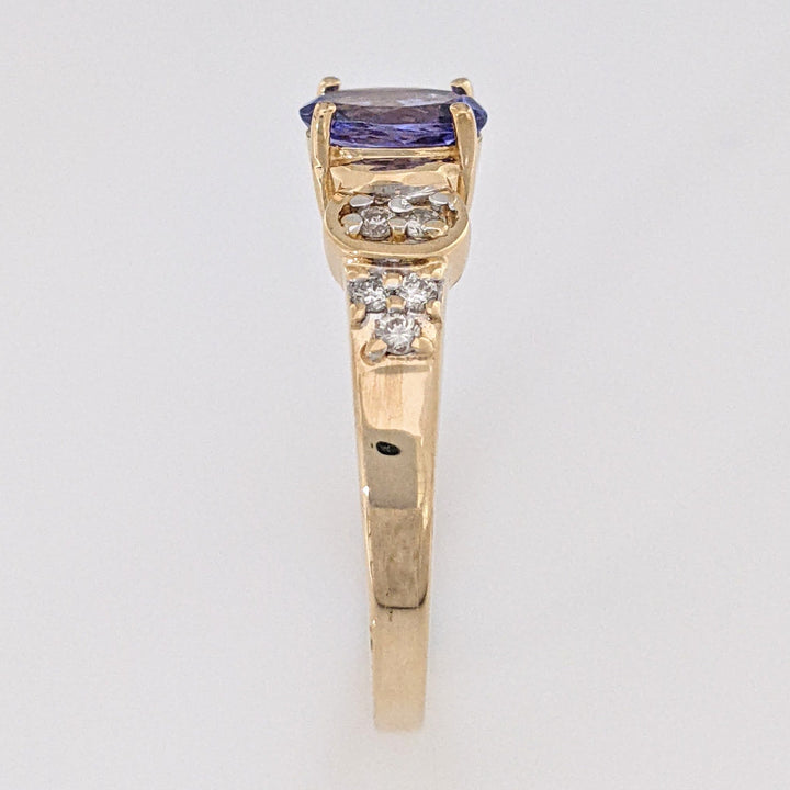 14K TANZANITE OVAL 5X7 WITH .10 DIAMOND TOTAL WEIGHT (10) ROUND ESTATE RING 3.2 GRAMS