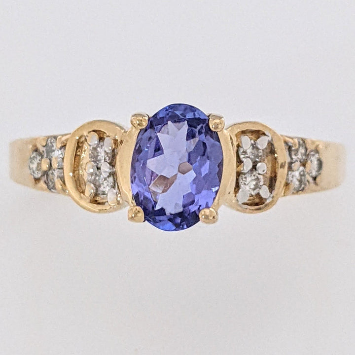 14K TANZANITE OVAL 5X7 WITH .10 DIAMOND TOTAL WEIGHT (10) ROUND ESTATE RING 3.2 GRAMS