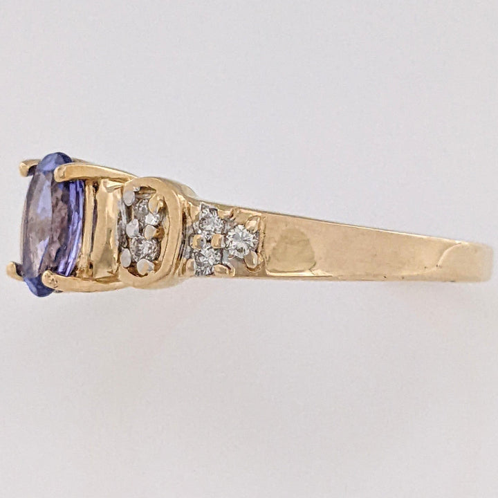 14K TANZANITE OVAL 5X7 WITH .10 DIAMOND TOTAL WEIGHT (10) ROUND ESTATE RING 3.2 GRAMS