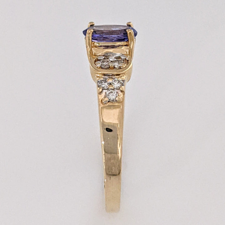 14K TANZANITE OVAL 5X7 WITH .10 DIAMOND TOTAL WEIGHT (10) ROUND ESTATE RING 3.2 GRAMS