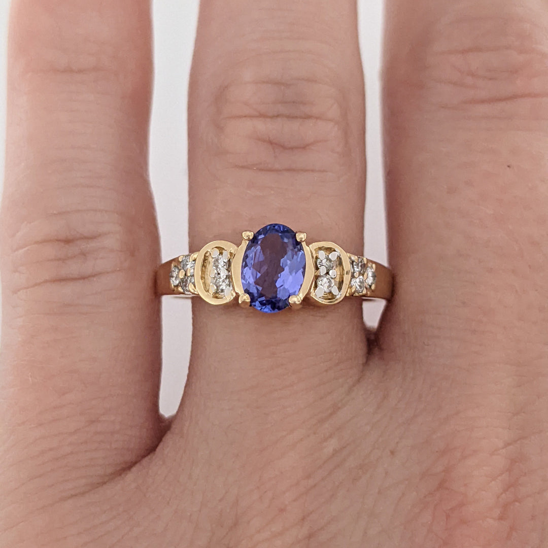 14K TANZANITE OVAL 5X7 WITH .10 DIAMOND TOTAL WEIGHT (10) ROUND ESTATE RING 3.2 GRAMS