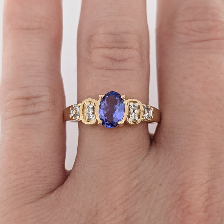 14K TANZANITE OVAL 5X7 WITH .10 DIAMOND TOTAL WEIGHT (10) ROUND ESTATE RING 3.2 GRAMS
