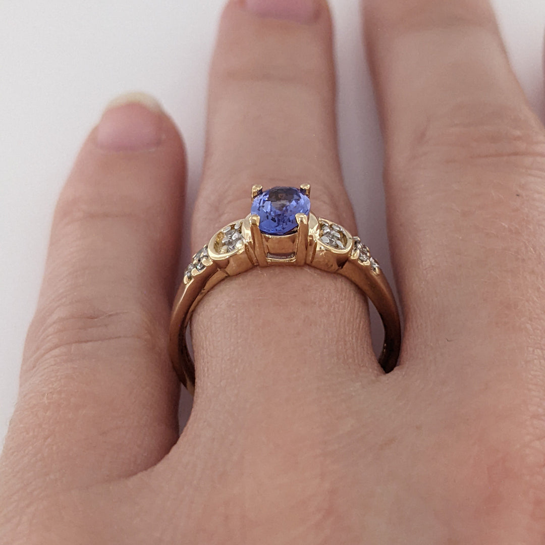 14K TANZANITE OVAL 5X7 WITH .10 DIAMOND TOTAL WEIGHT (10) ROUND ESTATE RING 3.2 GRAMS