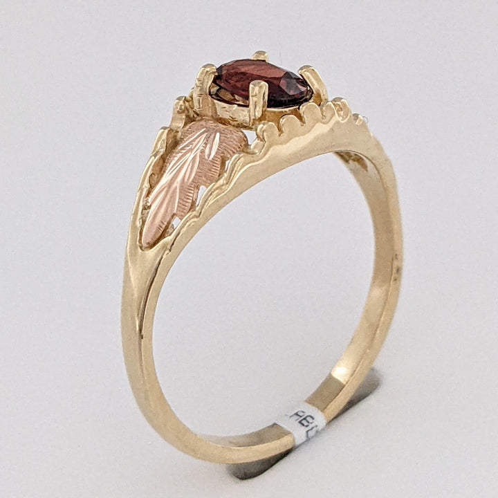 10K TWO-TONE GARNET OVAL 4X6 WITH ROSE LEAF ESTATE RING 2.2 GRAMS