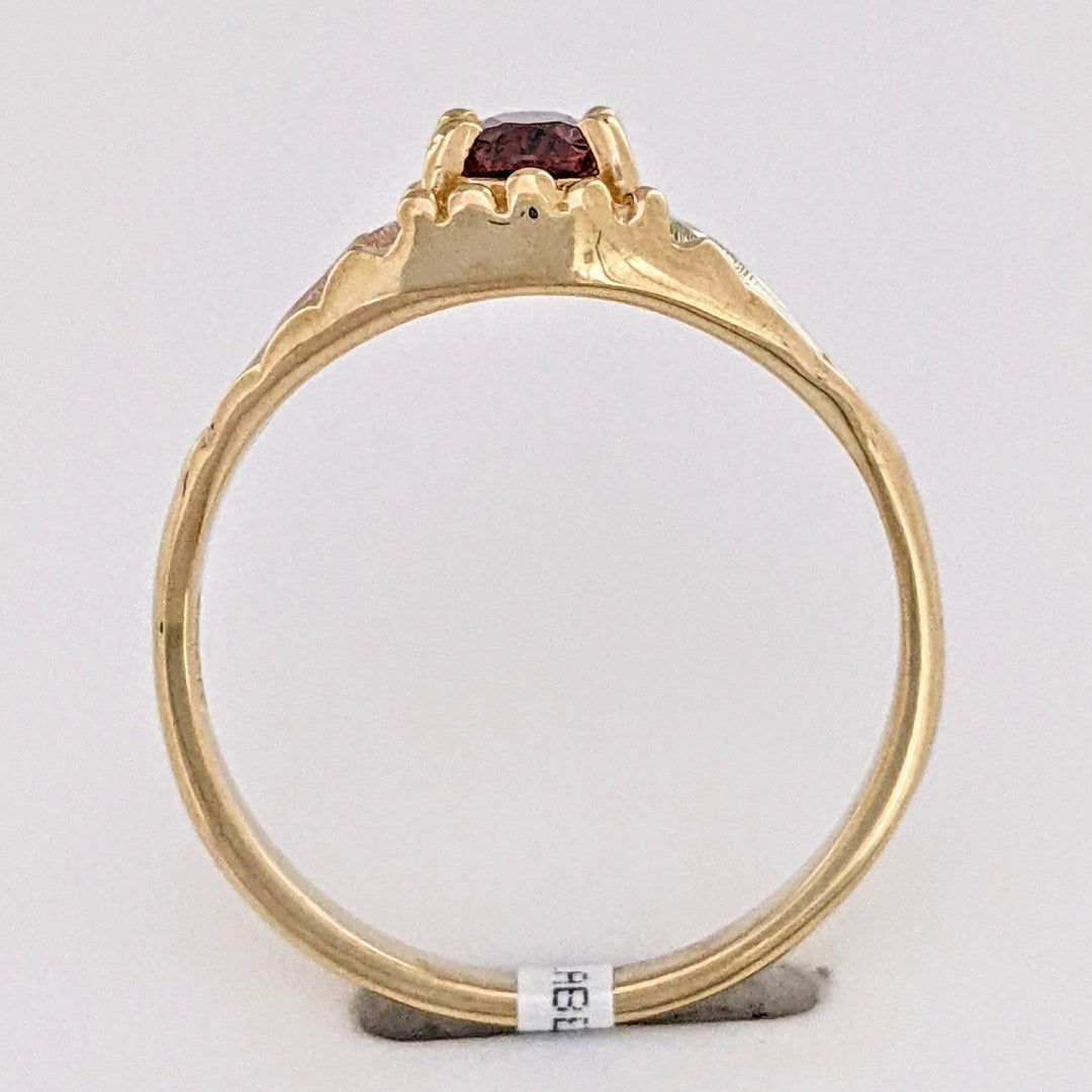 10K TWO-TONE GARNET OVAL 4X6 WITH ROSE LEAF ESTATE RING 2.2 GRAMS