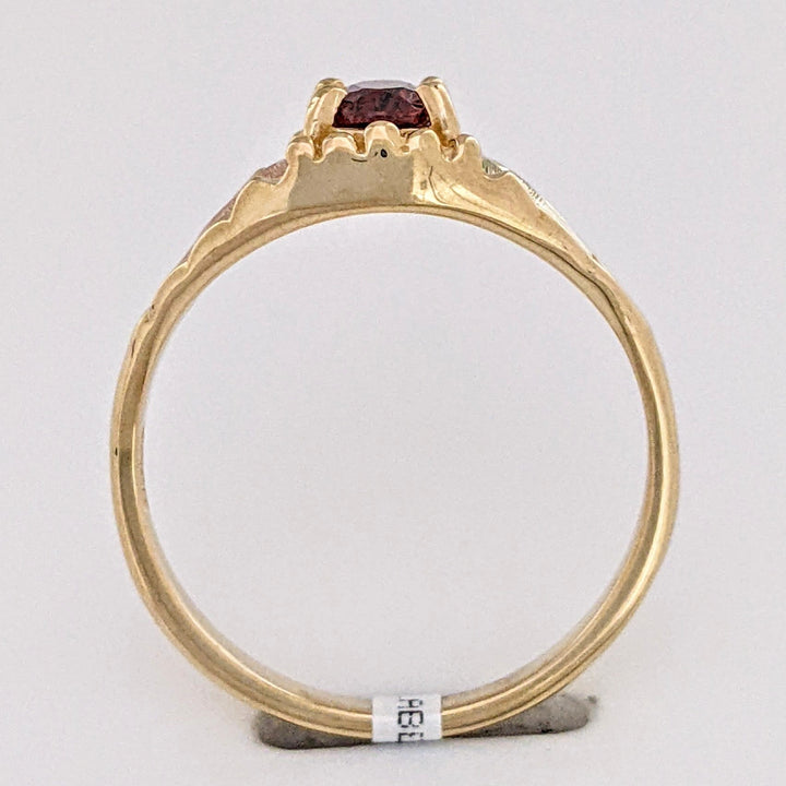 10K TWO-TONE GARNET OVAL 4X6 WITH ROSE LEAF ESTATE RING 2.2 GRAMS