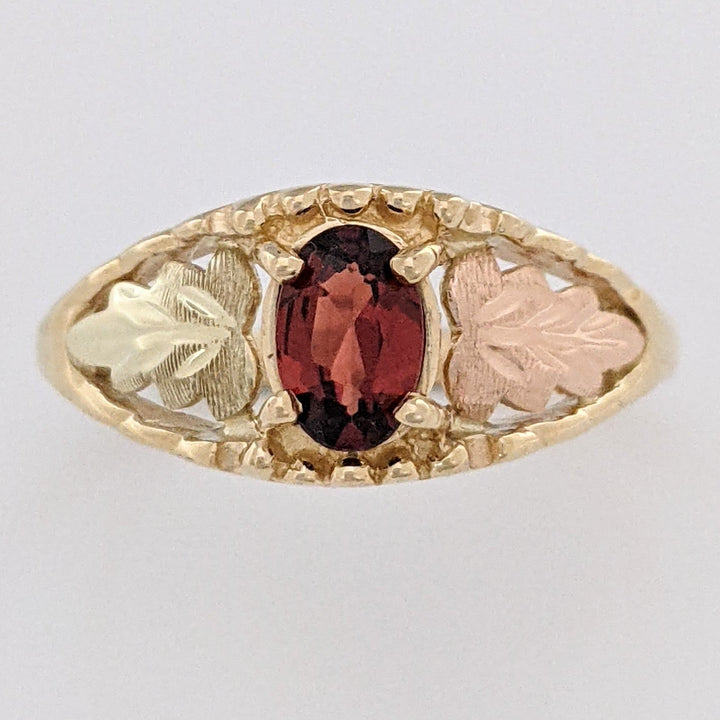 10K TWO-TONE GARNET OVAL 4X6 WITH ROSE LEAF ESTATE RING 2.2 GRAMS