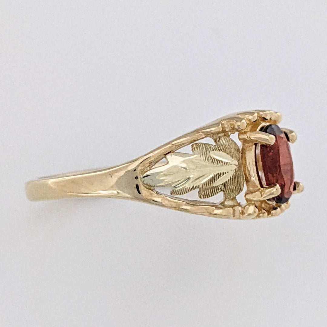 10K TWO-TONE GARNET OVAL 4X6 WITH ROSE LEAF ESTATE RING 2.2 GRAMS